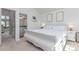Bedroom with a glimpse into the ensuite bathroom with double vanity sinks at 4676 S Dillon Ct # G, Aurora, CO 80015