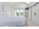 Spacious bedroom featuring white decor and barn doors for the closet at 4676 S Dillon Ct # G, Aurora, CO 80015