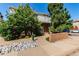 Building exterior with a private balcony, rock landscaping and a nearby walkway at 4676 S Dillon Ct # G, Aurora, CO 80015