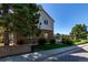 Exterior view of the building with a pool in the background and lush landscaping at 4676 S Dillon Ct # G, Aurora, CO 80015