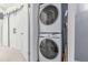 Stacked Samsung washer and dryer behind the barn doors at 4676 S Dillon Ct # G, Aurora, CO 80015