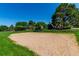Community park featuring a sandy volleyball court with net surrounded by green grass at 4676 S Dillon Ct # G, Aurora, CO 80015
