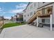 Backyard featuring a patio, stairs to the deck, and landscaped area with comfortable seating at 4792 Coltin Trl, Castle Rock, CO 80104