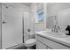 Bright bathroom with white vanity, toilet, and shower featuring a glass enclosure at 4792 Coltin Trl, Castle Rock, CO 80104