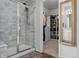 Bathroom featuring glass shower and doorway leading to the closet at 4792 Coltin Trl, Castle Rock, CO 80104
