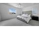 Bright bedroom featuring large window, tufted headboard and soft, neutral tones at 4792 Coltin Trl, Castle Rock, CO 80104
