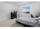 Neutral toned bedroom featuring expansive window with view and dark wood dresser at 4792 Coltin Trl, Castle Rock, CO 80104