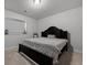 Comfortable bedroom featuring a dark wood frame bed and plush carpeting at 4792 Coltin Trl, Castle Rock, CO 80104