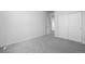 Empty bedroom featuring carpeted floors, light walls and a closet with sliding doors at 4792 Coltin Trl, Castle Rock, CO 80104
