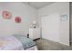 Bedroom featuring soft, neutral tones, pink flower prints and closet at 4792 Coltin Trl, Castle Rock, CO 80104