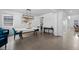 Dining room boasts hardwood floors, a modern chandelier, and elegant decor at 4792 Coltin Trl, Castle Rock, CO 80104