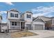 Attractive two-story home featuring a covered porch and a two-car garage at 4792 Coltin Trl, Castle Rock, CO 80104