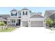 Charming two-story home with a two-car garage and a well-manicured front yard at 4792 Coltin Trl, Castle Rock, CO 80104