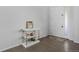 Bright foyer featuring hardwood floors, a console table, and a view of the front door at 4792 Coltin Trl, Castle Rock, CO 80104