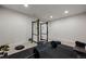 Finished home gym with weight lifting rack, bench, weights, and rubber flooring at 4792 Coltin Trl, Castle Rock, CO 80104