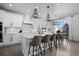 Bright kitchen with a large island, stainless steel appliances, modern lighting, and adjacent dining area at 4792 Coltin Trl, Castle Rock, CO 80104