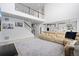 Open-concept living room with a staircase, a comfortable sofa, and hardwood floors at 4792 Coltin Trl, Castle Rock, CO 80104