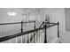 Second floor loft area with white railings and view of the staircase at 4792 Coltin Trl, Castle Rock, CO 80104