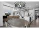 Spacious open floorplan with kitchen, dining area, living room, high ceilings, and modern lighting at 4792 Coltin Trl, Castle Rock, CO 80104