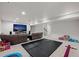 Spacious rec room with projector screen, large mat, and room to play at 4792 Coltin Trl, Castle Rock, CO 80104