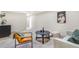 A spacious basement area with comfortable seating and modern decor creates a relaxing and inviting atmosphere at 135 Garnet St, Broomfield, CO 80020