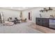 A finished basement with a stylish wet bar and cozy seating is perfect for entertaining or relaxing at 135 Garnet St, Broomfield, CO 80020