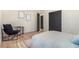 The bedroom features sleek black doors, hardwood floors, and ample space for comfortable living at 135 Garnet St, Broomfield, CO 80020