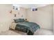 Bright bedroom featuring neutral walls and artwork, with a comfortable bed at 135 Garnet St, Broomfield, CO 80020