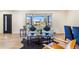 Bright living room featuring modern furniture, stylish decor, and large windows at 135 Garnet St, Broomfield, CO 80020