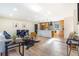 Open-concept living space showcasing a modern kitchen, dining area, and comfortable seating at 135 Garnet St, Broomfield, CO 80020