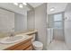 Bathroom features a single vanity, toilet, laundry hookups, and a large mirror at 16350 Hedgeway Dr, Parker, CO 80134