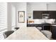 Modern dining area with marble table, stylish chairs, and contemporary light fixtures at 4395 Zuni St, Denver, CO 80211