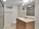 Bathroom featuring a vanity with a sink and tiled shower at 3292 S Wabash Ct, Denver, CO 80231