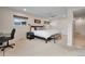 Spacious bedroom with a ceiling fan, neutral carpet, and a large bed with a view to the outside at 3292 S Wabash Ct, Denver, CO 80231