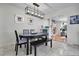 Spacious dining room with open layout, seamlessly connected to a living room with a fireplace at 3292 S Wabash Ct, Denver, CO 80231