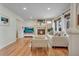 Cozy living room featuring a fireplace, hardwood flooring and modern furniture at 3292 S Wabash Ct, Denver, CO 80231