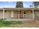 Cozy covered patio featuring a dining set and access to backyard at 3292 S Wabash Ct, Denver, CO 80231