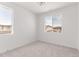 Sunlit bedroom with large windows offering ample natural light and neutral carpeting at 5773 N Jericho Way, Aurora, CO 80019