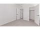 Bedroom with a closet and view into an adjacent room through a white door at 5773 N Jericho Way, Aurora, CO 80019