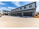 Row of attached garages offering ample parking space in modern townhome community at 5773 N Jericho Way, Aurora, CO 80019