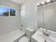 Clean bathroom featuring a shower-tub combination, white subway tile, and neutral decor at 9400 High St, Thornton, CO 80229