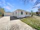 Charming home featuring a large driveway, a detached garage and a well-manicured front yard at 9400 High St, Thornton, CO 80229