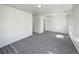Spacious living room with neutral carpet and natural light at 9400 High St, Thornton, CO 80229
