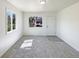 Bright living room with neutral carpet and plenty of natural light at 9400 High St, Thornton, CO 80229