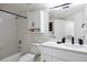 Well-lit bathroom features a shower over tub and sink with modern fixtures at 12820 Ironstone Way # 301, Parker, CO 80134