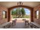 Inviting brick-lined lounge area offering an open view of well-manicured landscaping on a beautiful day at 12820 Ironstone Way # 301, Parker, CO 80134