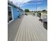 Expansive back deck offering views of the surrounding landscape with seating and fire pit at 58117 E 42Nd Dr, Strasburg, CO 80136