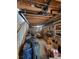 Spacious unfinished basement with exposed pipes, storage and stairs to main level at 58117 E 42Nd Dr, Strasburg, CO 80136