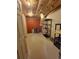 Unfinished basement with storage shelves, bare floors, insulation, and concrete walls at 58117 E 42Nd Dr, Strasburg, CO 80136