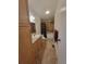 Well-lit bathroom features single sink vanity, tiled floor, and bathtub with shower at 58117 E 42Nd Dr, Strasburg, CO 80136